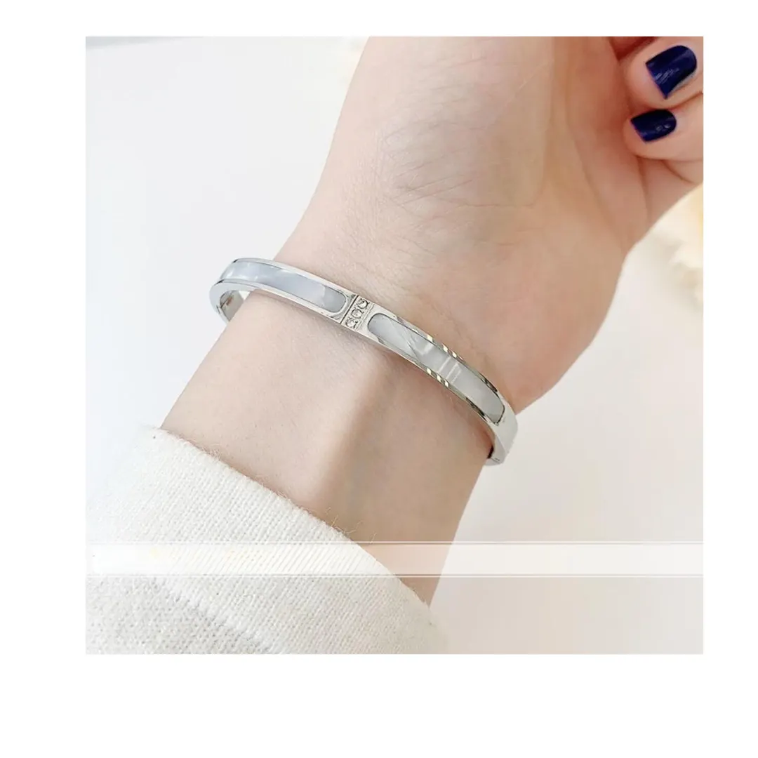 Yourparagraphtext_8_58bd11b7-64e4-4846-8b51-ea8817e617eb White Mother-of-Pearl & Zircon Oval Bracelets – Elegant, Timeless Design - Image 1