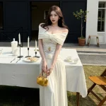 Ivory off-shoulder lace-panel maxi dress, front view