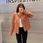 Red and cream houndstooth cropped jacket worn with black trousers